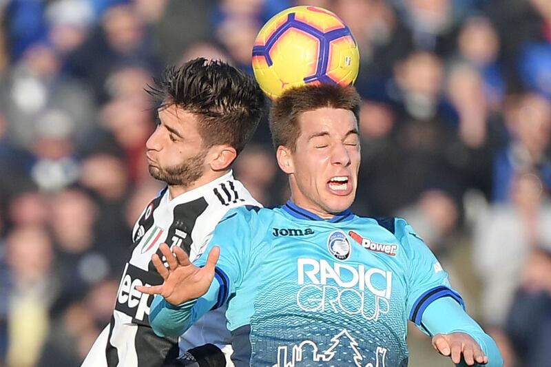 Juventus' Uruguayan midfielder Rodrigo Bentancur (L) and Atalanta's Croatian midfielder Mario Pasalic go for a header during the Italian Serie A football Match Atalanta Bergamo vs Juventus  at the Atleti Azzurri d'Italia stadium in Bergamo.  AFP