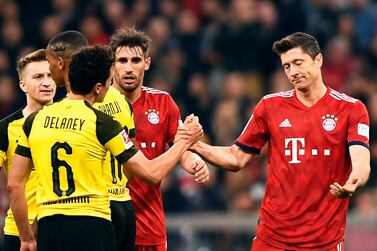 Robert Lewandowski, right, and his Bayern Munich side lead the Bundesliga table with nine games of the season remaining. EPA