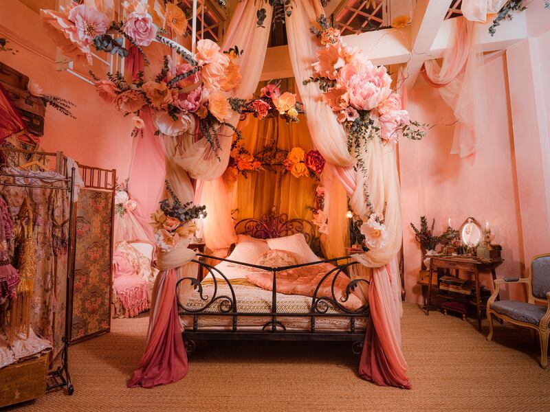 An opulent boudoir is filled with exquisite Art Nouveau features including a miniature paper stage to immerse guests in the spirit of the cabaret.