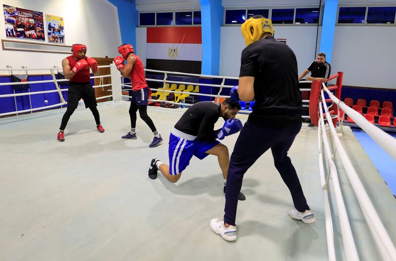 Yousry Rezk, right, pictured with Egypt's national team coach Saeed Hassan, is also competing at the Olympics, in the super heavyweight class.