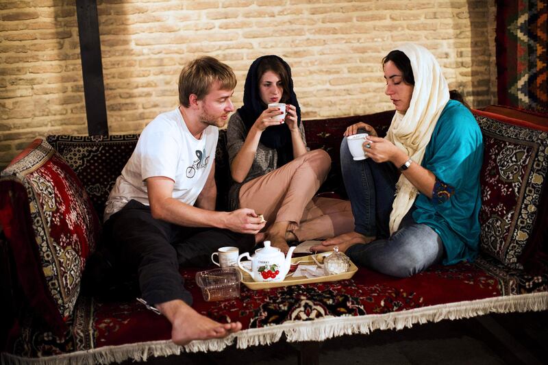 Tourists drink tea in a tea house in the city of Shiraz, south of Tehran. Behrouz Mehri / AFP