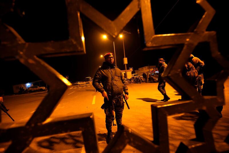Palestinian security forces loyal to Hamas (R) stand guard the Rafah border crossing with Egypt, on January 7, 2019. The Palestinian Authority said Sunday it was withdrawing staff from the Rafah border post with Egypt in the southern Gaza Strip to protest against "brutal practices" by rival faction Hamas. / AFP / SAID KHATIB
