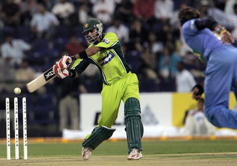 Pakistani batsman Shoaib Malek hits the ball of Indian bowler S.Sreesanth (R) during the cricket match between India and Pakistan at the Zayad Cricket Stadium in Abu Dhabi, 18 April 2006. Proceeds from the match will be donated to the survivors of the massive earthquake that hit Kashmir last October killing more than 73,000 people in Pakistan and 1,300 in India. AFP Photo/RABIH MOGHRABI / AFP PHOTO / RABIH MOGHRABI