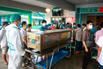 Coffins are lined up outside a crematorium in Myanmar during a coronavirus surge. AP