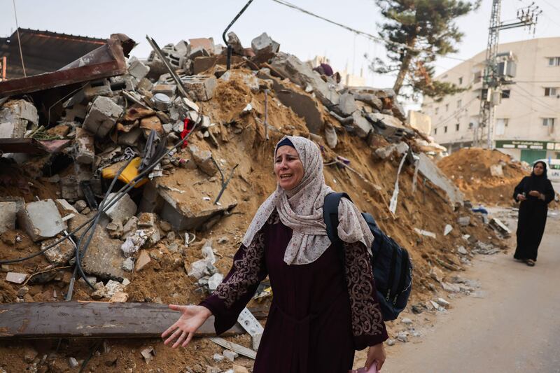 A woman cries next to the rubble of a building after Israeli strikes on Rafah in the south of the Gaza Strip. AFP