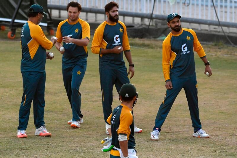 Pakistan's Imad Wasim, second right, and Mohammad Hafeez train ahead of the first Twenty20 against Zimbabwe. AFP