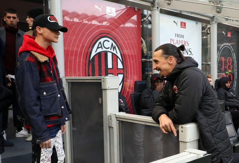 Milan's Zlatan Ibrahimovic chats with one of his sons. EPA