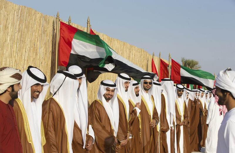 The grooms line up at the mass wedding which was attended by Sheikh Hamdan bin Zayed