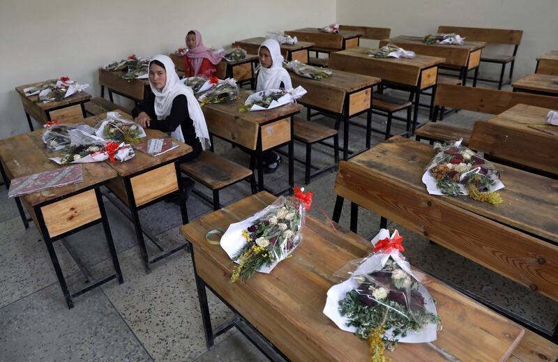 Kabul schoolgirls pay tribute to those killed in a May bombing of the Syed Al Shahda girls school. The UN said that more women and children were killed and wounded in Afghanistan in the first half of 2021 than in any year since the UN began keeping count in 2009. AP