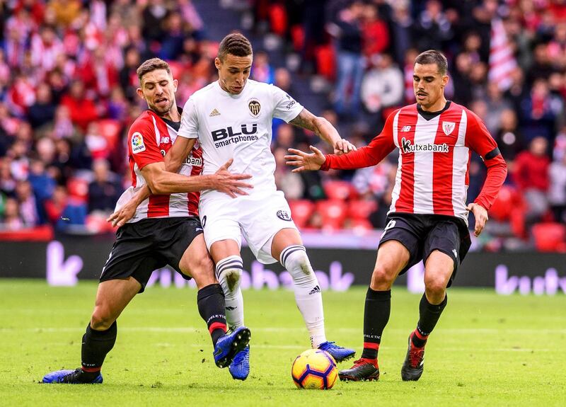 Valencia's Rodrigo Moreno in action against Athletic Bilbao players Yeray Alvarez and Dani Garcia. EPA