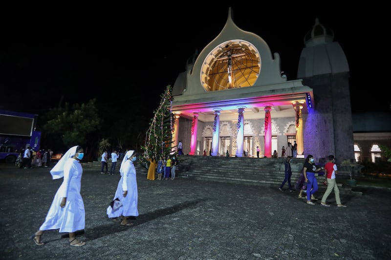 Worshipers attend the Christmas Eve midnight Mass at The Basilica of Our Lady of Lanka in Ragama suburb of Colombo, Sri Lanka. EPA