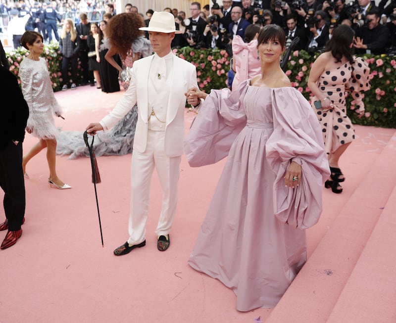 Looking like a modern day Oscar Wilde, Benedict Cumberbatch strode the red carpet in head to toe white, and carrying a cane. His wife, Sophie Hunter wore palest lilac.  EPA