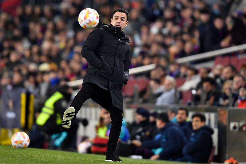 Barcelona coach Xavi stands on the sideline. AFP