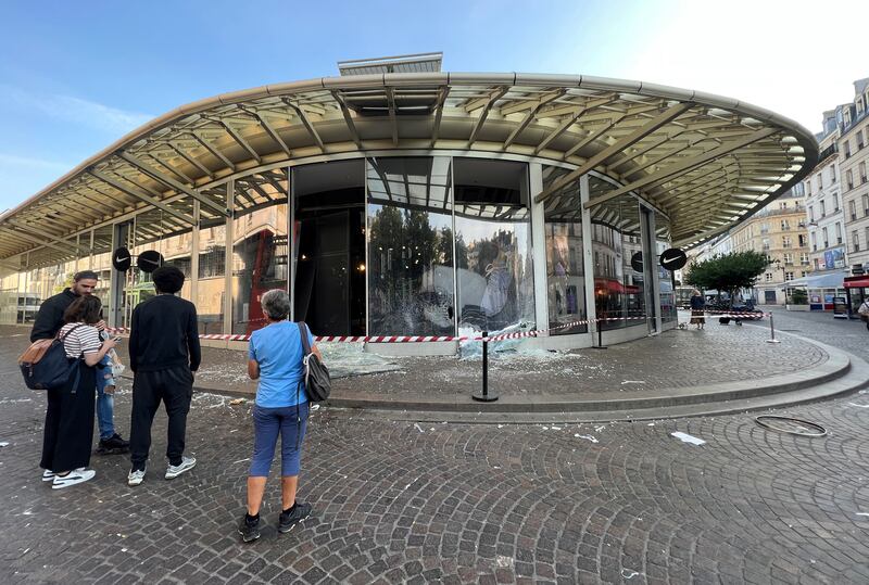 Smashed windows at the Nike store in Paris. Reuters