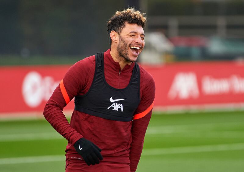 Alex Oxlade-Chamberlain of Liverpool laughs during a training session at AXA Training Centre in Kirkby, England. All photos by Getty Images