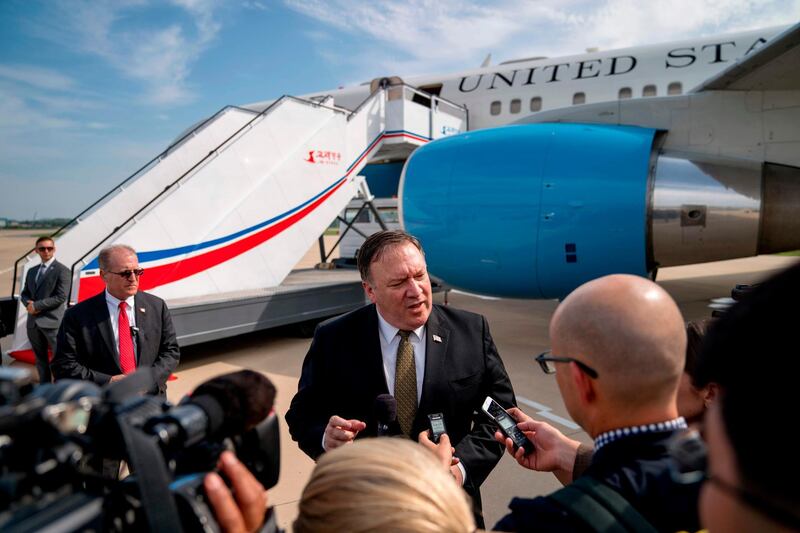 US Secretary of State Mike Pompeo speaks to members of the media following two days of meetings with Kim Yong Chol, a North Korean senior ruling party official and former intelligence chief, before boarding his plane at Sunan International Airport in Pyongyang on July 7, 2018. Pompeo held talks in an elegant Pyongyang guest house for a second day with North Korean leader Kim Jong Un's right-hand man Kim Yong Chol. / AFP / POOL / Andrew Harnik
