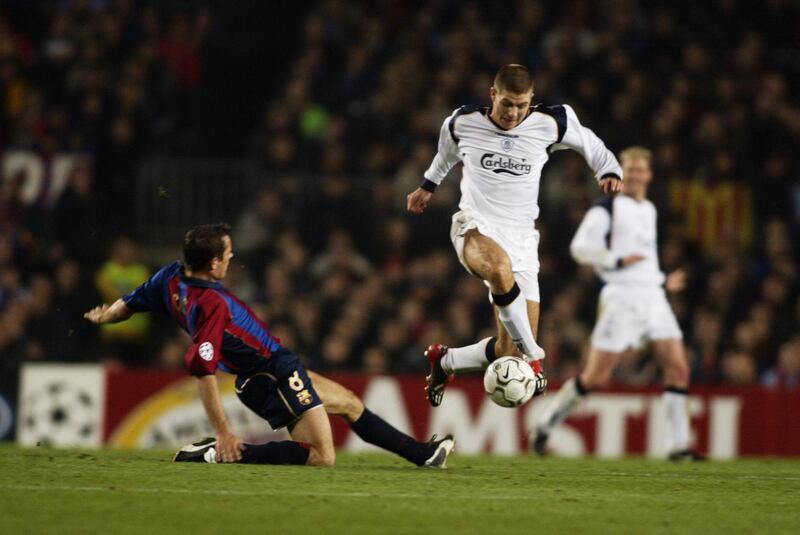 13 Mar 2002:  Steven Gerrard of Liverpool takes the ball past Phillip Cocu of Barcelona during the UEFA Champions League Group B match played at the Nou Camp, in Barcelona, Spain. The match ended in a 0-0 draw. DIGITAL IMAGE. \ Mandatory Credit: Phil Cole/Getty Images \