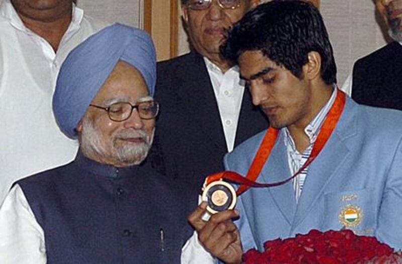 Boxer Vijender Singh, right, seen here with the Indian prime minister Manmohan Singh, needs to stay focused.