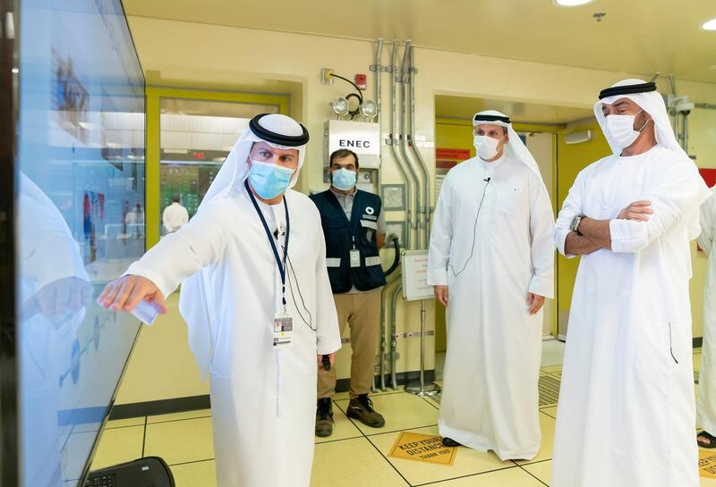 AL DHAFRA, ABU DHABI, UNITED ARAB EMIRATES - June 11, 2020: HH Sheikh Mohamed bin Zayed Al Nahyan, Crown Prince of Abu Dhabi and Deputy Supreme Commander of the UAE Armed Forces (R) views a presentation by HE Mohamed Al Hammadi, CEO Emirates Nuclear Energy Corporation (ENEC) (L), during the inspection of the Barakah Peaceful Nuclear Energy Plants, in Barakah. Seen with HE Khaldoon Khalifa Al Mubarak, CEO and Managing Director Mubadala, Chairman of the Abu Dhabi Executive Affairs Authority and Abu Dhabi Executive Council Member (2nd R).

( Mohamed Al Hammadi / Ministry of Presidential Affairs )
---