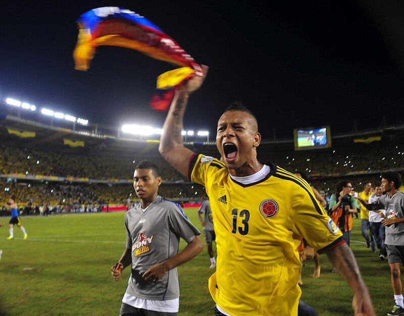 Colombia 3-3 Chile. Midfielder Fredy Guarin celebrates Colombia's entry to the World Cup from Conmebol. Luis Acosta / AFP