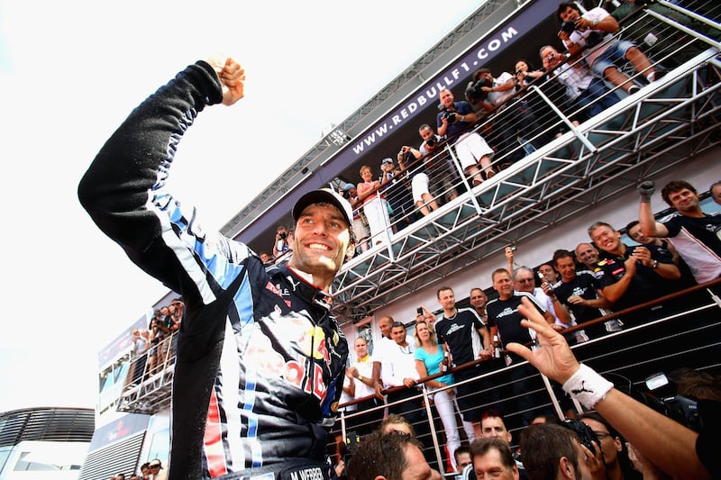 NORTHAMPTON, UNITED KINGDOM - JULY 11:  Mark Webber of Australia and Red Bull Racing celebrates in the paddock after winning the British Formula One Grand Prix at Silverstone on June 11, 2010, in Northampton, England.  (Photo by Malcolm Griffiths/Getty Images)