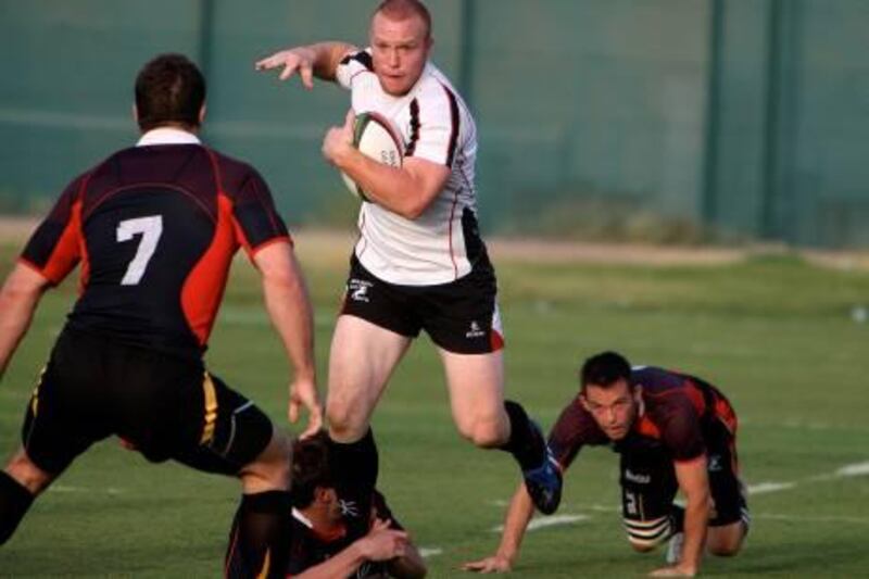 AL AIN, UNITED ARAB EMIRATES, April 2: Duncan Murray (in white) of Arabian Gulf rugby team during the rugby match between Arabian Gulf vs Gulf Barbarians at rugby ground in Palm Sports Resort in Al Ain.  (Pawan Singh / The National) For Sports