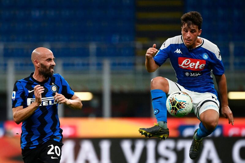 Napoli's German midfielder Diego Demme jumps for the ball past Napoli's Polish defender Piotr Zielinski. AFP