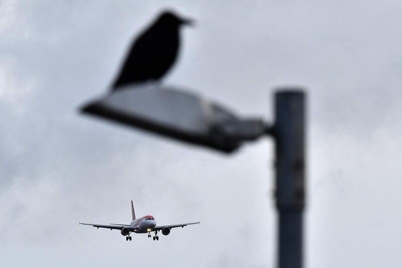 An EasyJet aircraft prepares to land at London Gatwick Airport. AFP