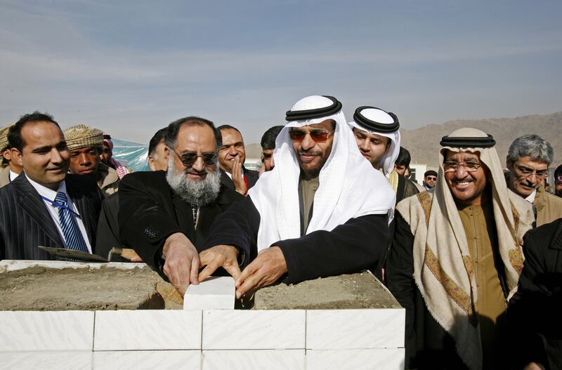 Khalifa Al Suwaidi, centre, chairman of the board of directors for the UAE Red Crescent, puts the corner stone of the Second Phase of Zayed City, in Kabul in December 2007.  Ahmed Jadallah / Reuters