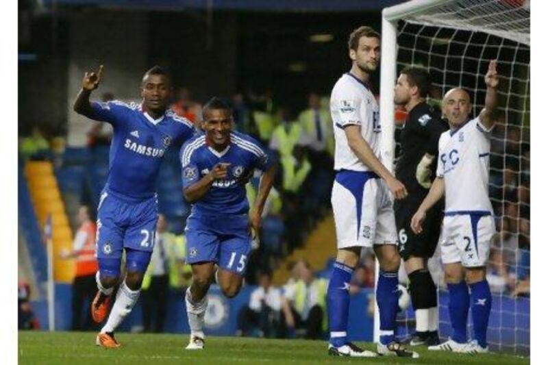 Chelsea's Florent Malouda, second left, celebrates opening the scoring against Birmingham City last night.