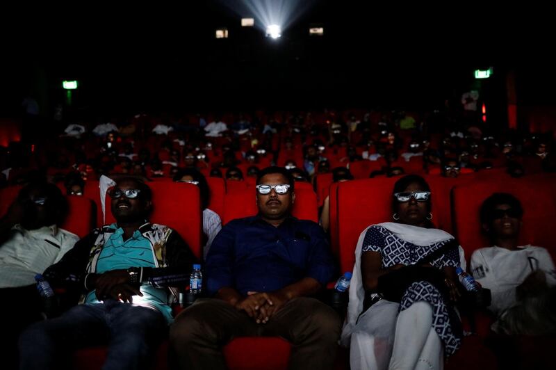 Fans watch Rajinikanth in "2.0" inside a cinema hall. Reuters