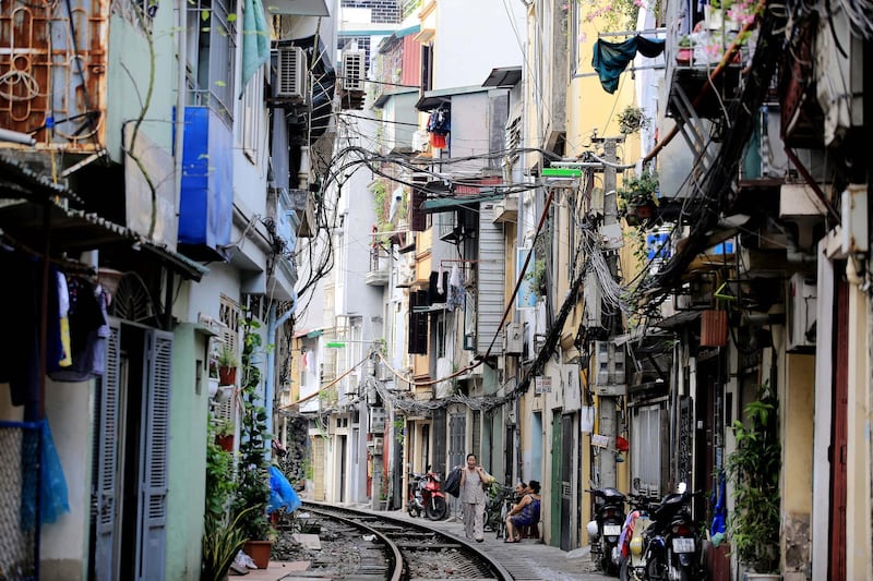 A woman walks along a railway in an alley in Hanoi, Vietnam. There were 164 railway accidents in 2017, killing 133 people and injuring 50, according to a report from the Vietnam Railways Corporation. According to Vu Quang Khoi, director of the railway department under the Ministry of Transport at a meeting recently, its the lack of human resources as well as necessary equipment at railway stations that is the weaknesses of Vietnam's railway system.  Luong Thai Linh / EPA