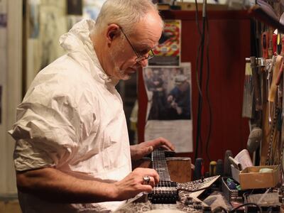 Philippe Dubreuille works on a guitar in his studio in a basement in Denmark Street, London, where he repaired the ES-355. Getty