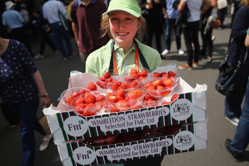 Strawberries - the traditional food of Wimbledon spectators - are carried around the grounds in 2013.