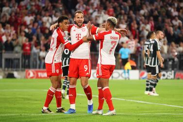 MUNICH, GERMANY - SEPTEMBER 20: Serge Gnabry of Bayern Munich celebrates with team mates Jamal Musiala and Harry Kane after scoring their sides second goal during the UEFA Champions League match between FC Bayern München and Manchester United at Allianz Arena on September 20, 2023 in Munich, Germany. (Photo by Alex Grimm / Getty Images)