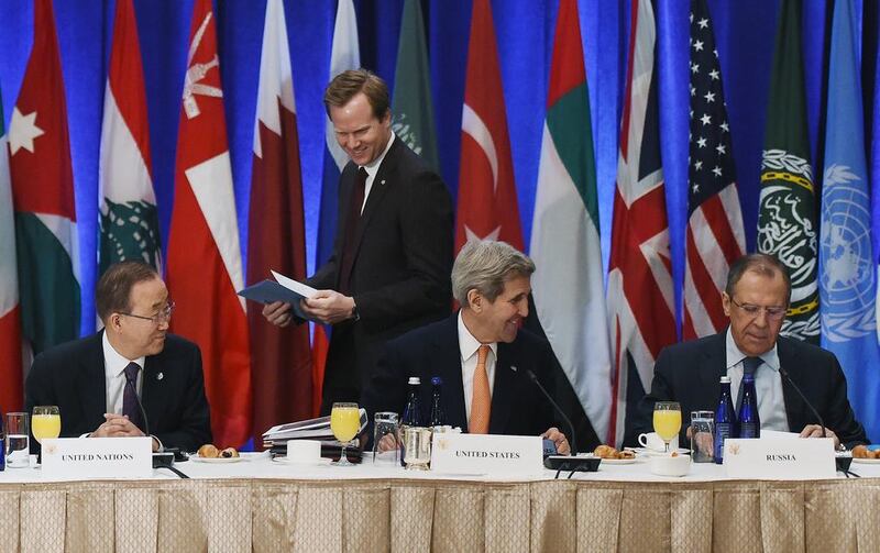 US secretary of state John Kerry (C) talks to Russian foreign minister Sergei Lavrov (R) before the start of the meeting on Syria as UN secretary general Ban Ki-moon (L) looks on, at a hotel in New York on December 18, 2015. Jewel Samad/Pool/Reuters