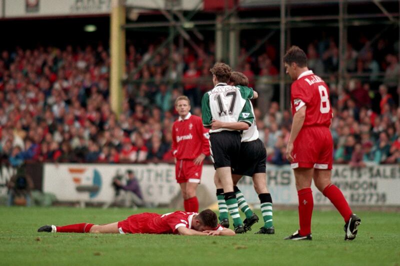 Swindon Town players can only look dejected as Steve McManaman celebrates Liverpool's fifth goal with scorer Ronnie Whelan  (Photo by Ross Kinnaird - PA Images via Getty Images)
