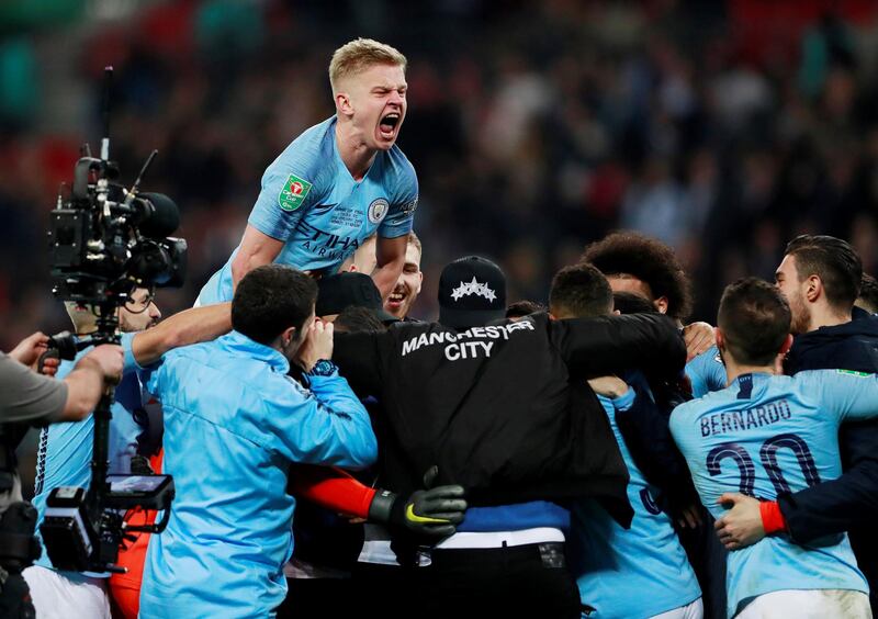 Manchester City's Oleksandr Zinchenko and team mates celebrate after winning the penalty shootout. Action Images via Reuters