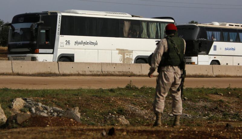 Buses carrying rebels who were evacuated from al-Rastan are seen in Homs countryside, Syria May 7, 2018. REUTERS/Omar Sanadiki
