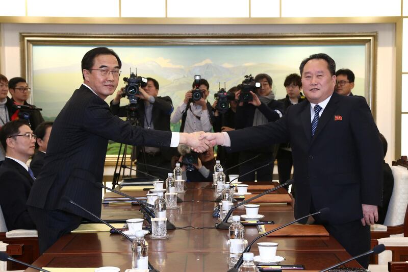 Head of the North Korean delegation Ri Son Gwon shakes hands with his South Korean counterpart, Cho Myoung-gyon, during their meeting at the truce village of Panmunjom. Reuters
