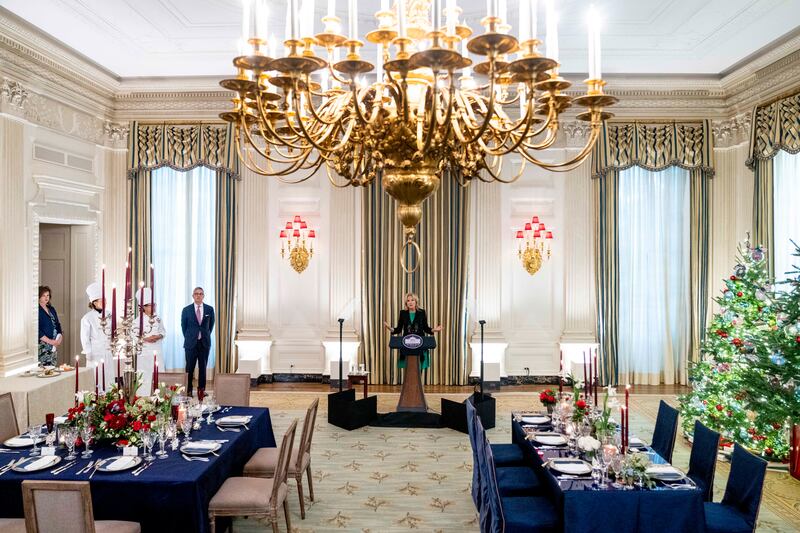 US first lady Jill Biden is accompanied by Ms Comerford before the White House state dinner. AP