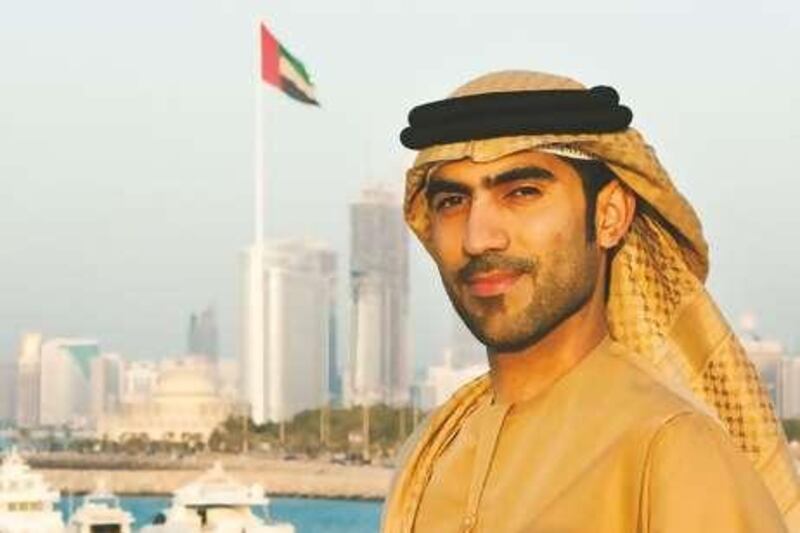 08/11/09 - Abu Dhabi, UAE -Ali Alsaloom, of Ask Ali column for M Magazine, stands in front of the skyline of Abu Dhabi on November 8, 2009.  (Andrew Henderson / The National)