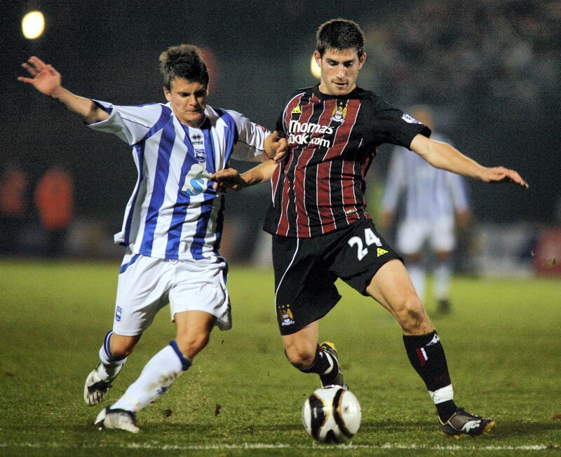 Manchester City's  Welsh Striker Ched Evans (R) Served a two-and-a-half-year prison sentence following a rape conviction that was subsequently quashed. Now at Fleetwood after previously playing for Sheffield United. AFP PHOTO 