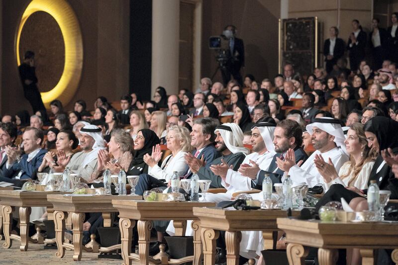 ABU DHABI, UNITED ARAB EMIRATES - March 13, 2019: HE Noura Mohamed Al Kaabi, UAE Minister of Culture and Knowledge Development (R), HH Sheikh Hilal bin Diab Al Nahyan (3rd R), Khalfan Al Mazrouei, Managing Director at the Special Olympics World Games Abu Dhabi 2019 (5th R), HH Sheikh Nahyan Bin Zayed Al Nahyan, Chairman of the Board of Trustees of Zayed bin Sultan Al Nahyan Charitable and Humanitarian Foundation (6th R), Timothy Shriver, Chairman of the Special Olympics (7th R), HE Hessa Essa Buhumaid, UAE Minister of Community Development (9th R), and HE Awaidha Murshed Al Murar, Chairman of the Department of Energy and Abu Dhabi Executive Council Member (11th R), applaud after a lecture by Loretta Claiborne, Chief Inspiration Officer, Vice Chair of the Special Olympics International Board of Directors (not shown), titled "Changing the Game for Inclusion", at Emirates Palace. 
( Ryan Carter / Ministry of Presidential Affairs )?