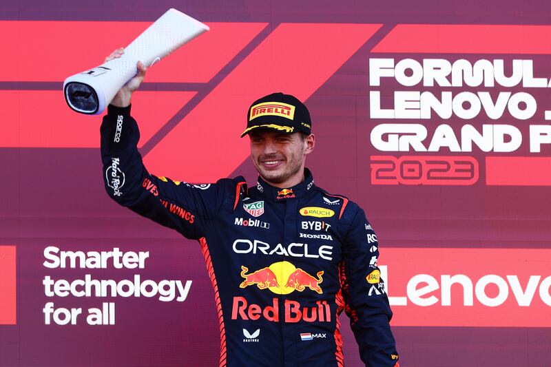 Max Verstappen lifts the trophy after winning the Japanese Grand Prix at Suzuka Circuit. Getty