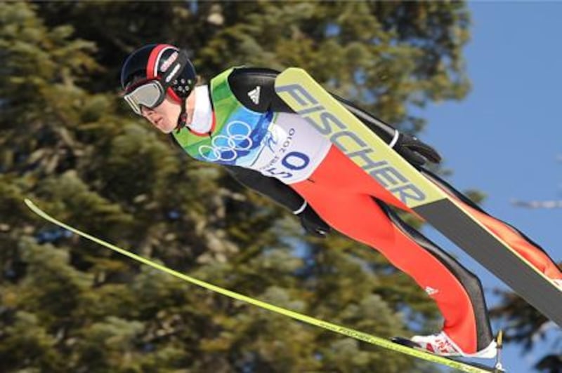 Simon Amman jumped 144 metres to capture gold for the second time at the Winter Olympics.