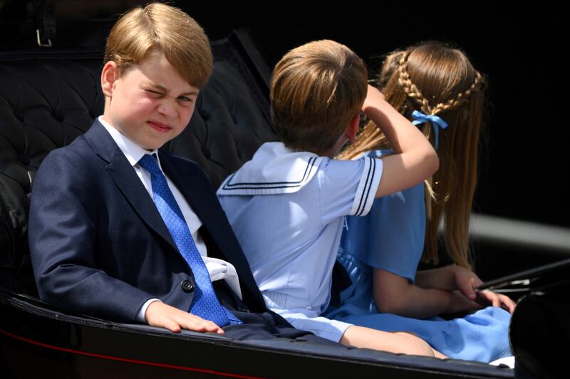 Prince George, Prince Louis and Princess Charlotte ride in a horse-drawn carriage during the Trooping the Colour parade. Reuters