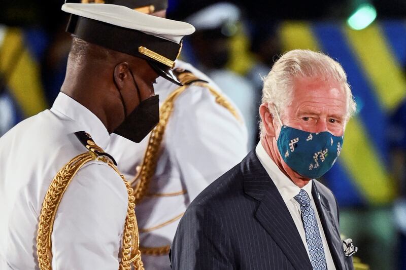 Britain's Prince Charles wears a face mask at the ceremony in Bridgetown, Barbados. Reuters