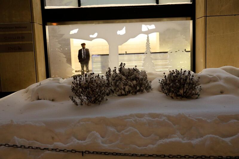 A man is seen though a window during the snow storm in New York City. Mike Segar / Reuters