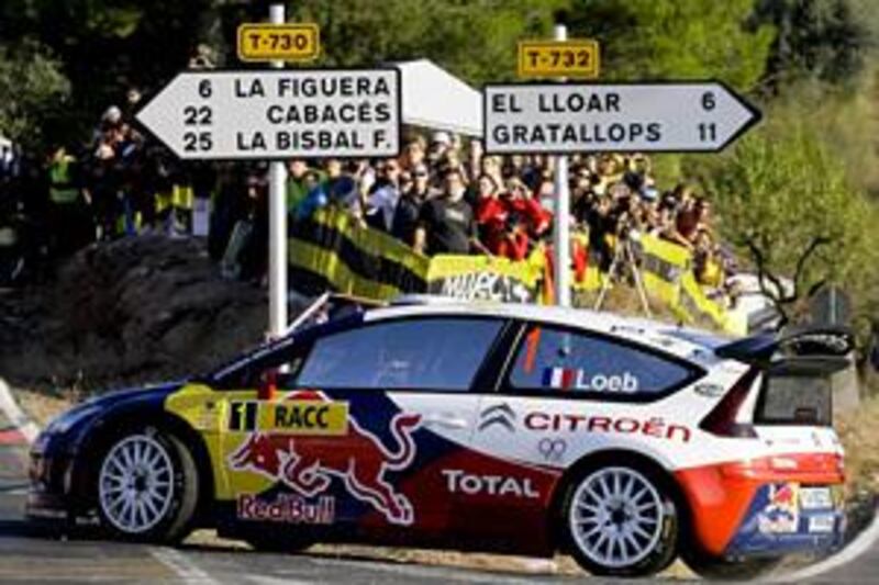 Sebastien Loeb and co-driver Daniel Elena on their way to a commanding position in Rally Spain yesterday. Both men have agreed to stay with Citroen for next year's World Rally Championship.